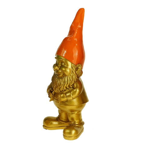 Goldfarbener Zwerg mit oragner Mütze.