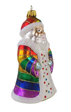 Lade das Bild in den Galerie-Viewer, Christbaumschmuck aus Glas in Form eines Weihnachtsmann mit Regenbogenmantel und -mütze.