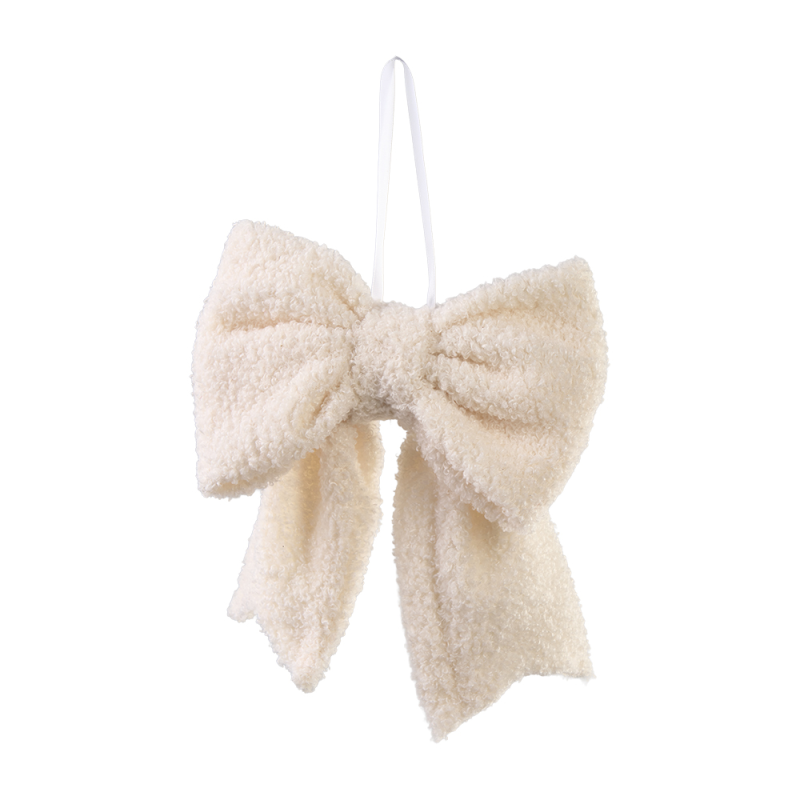 Cremeweiße Schleife aus Teddyfell als Anhänger für den Weihnachtsbaum.