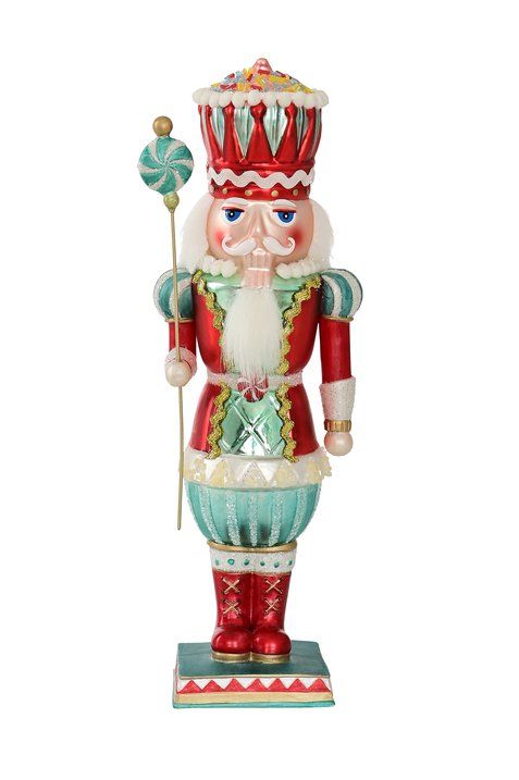 Nussknacker von Gift Company als Deko-Figur aus Glas. Der Nussknacker trägt eine Uniform in den Farben Türkis und Rot mit glitzerdem Dekor.