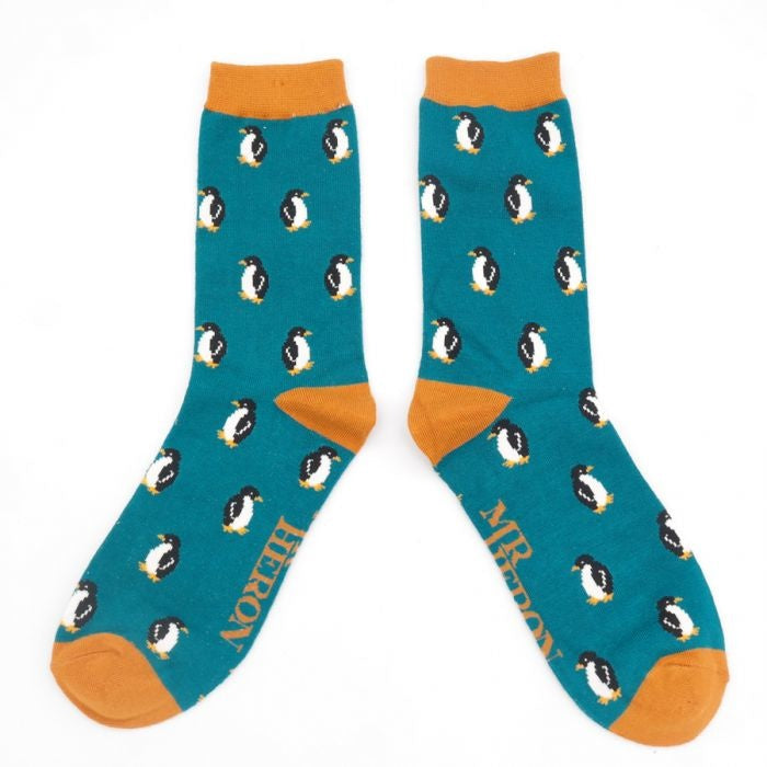 Petrolblaue Herrensocken mit Pinguin-Muster.