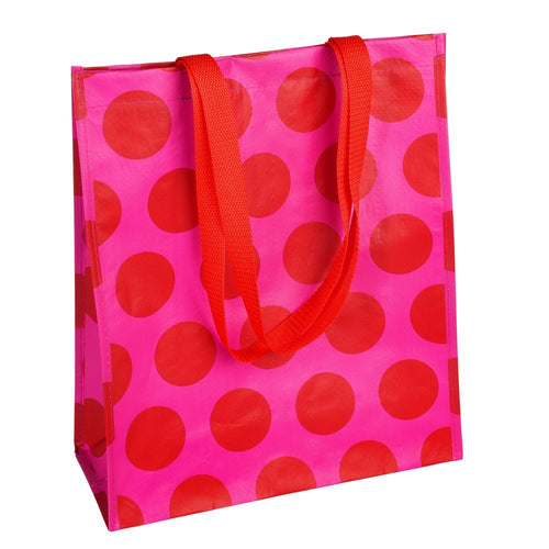Mehrweg-Einkaufstasche von Rex London aus recycletem Kunststoff. Die Tasche ist pink mit roten Punkten und hat Nylongriffe.