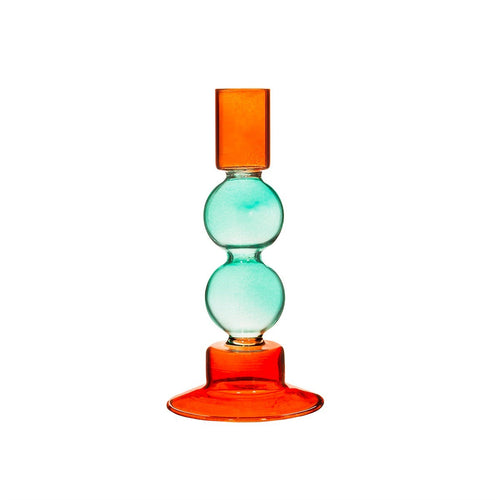Kerzenhalter im Kugel-Design von Sass & Belle aus buntem Glas. Die Bubbles sind türkis, der Standfuß und die Tülle sind rot.